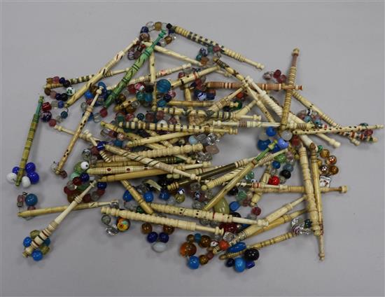 A collection of approximately 50 19th century patterned and strapworked bone and ivory lace bobbins